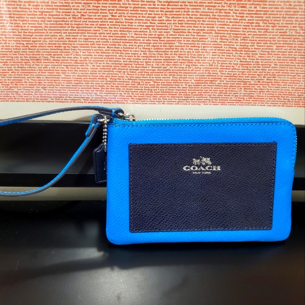 NWOT Coach wristlet with exterior pocket